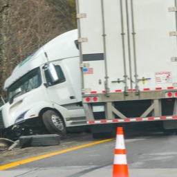 A car in an accident with a semi-truck.