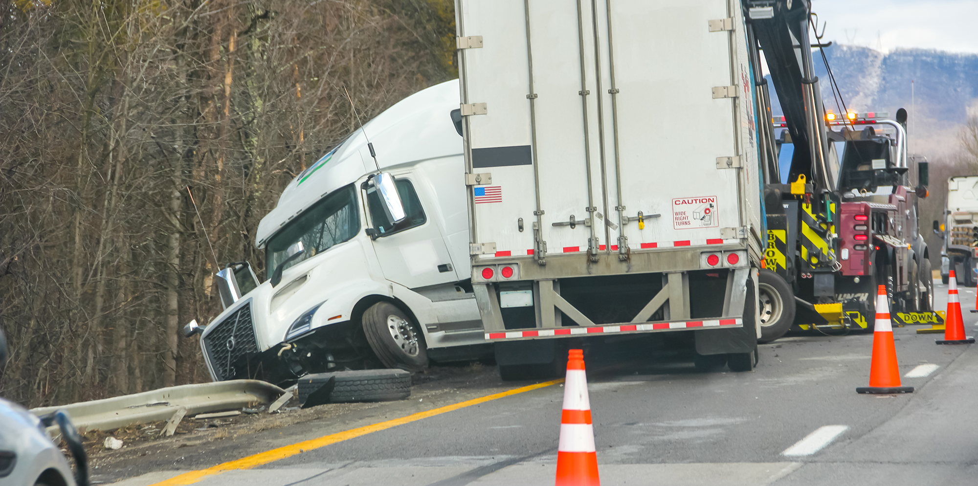 A car in an accident with a semi-truck.