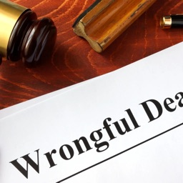A judge's gavel and a judgement saying Wrongful Death.