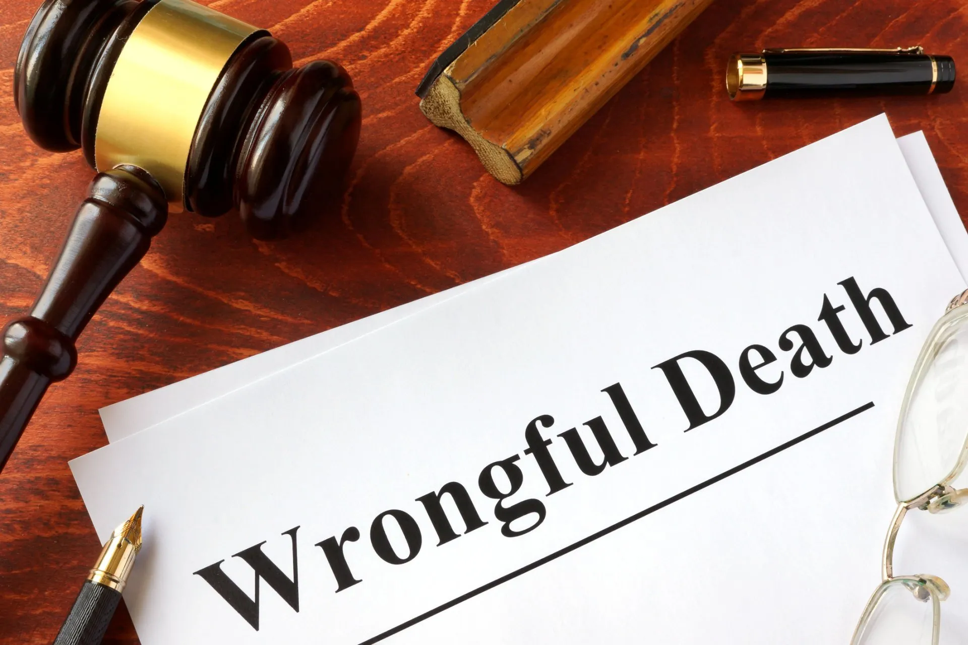 A judge's gavel and a judgement saying Wrongful Death.